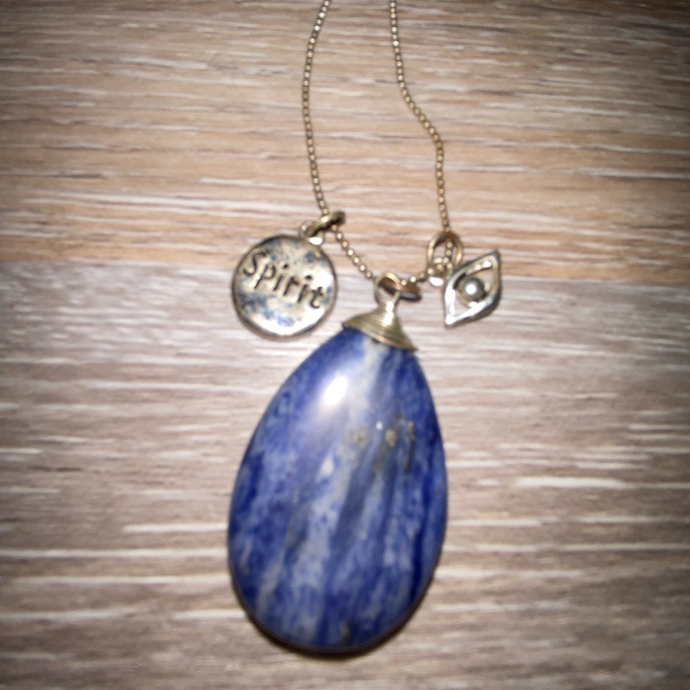 Blue stone pendant, evil eye, and spirit charm necklace